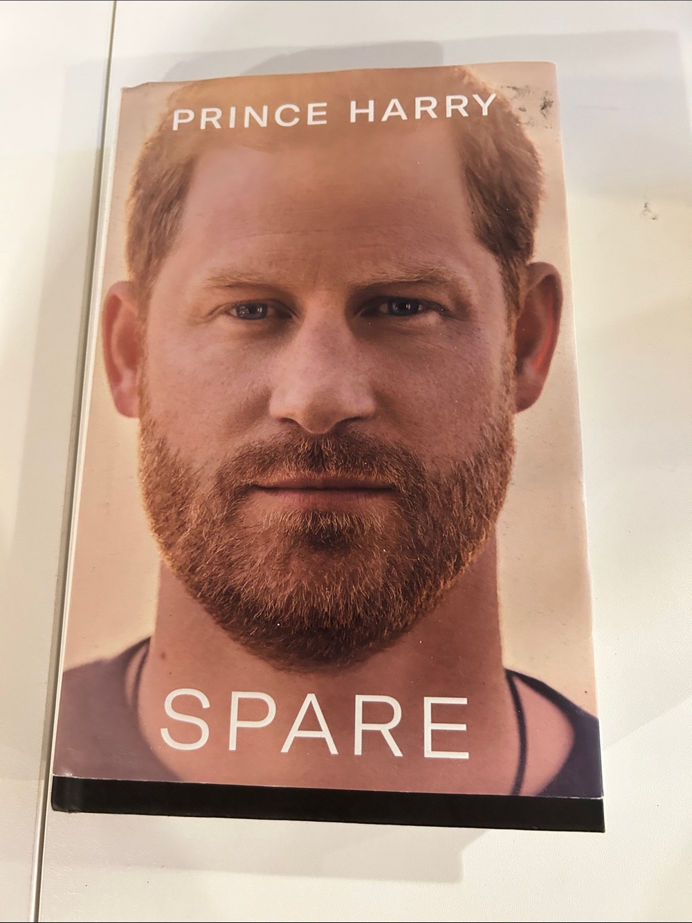 Spare by — Paperback Book in Light Brown Cover